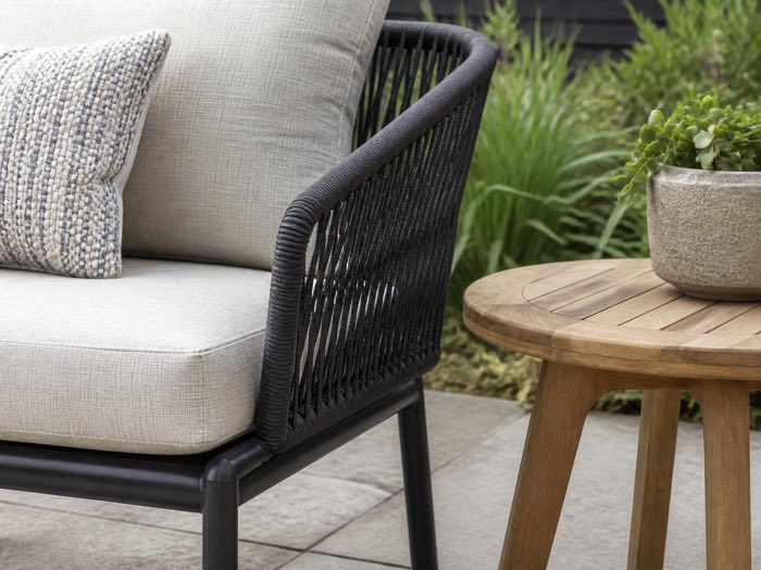 Close view of weather-resistant outdoor chair materials and cushion fabric